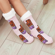 Load image into Gallery viewer, The Foozie™ Chocolate slipper socks, chocolate bar print on pink, worn on a wooden floor