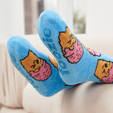 Load image into Gallery viewer, The Foozie™ Ice Cream slipper socks, feet up on the sofa, soles showing the foozie grips