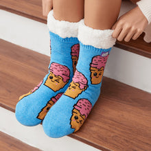Load image into Gallery viewer, The Foozie™ Ice Cream slipper socks, close-up worn sitting on a wooden stair