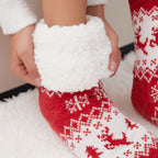 The Foozie™ Christmas Reindeer slipper socks, close-up of hands holding the thick sherpa cuff open