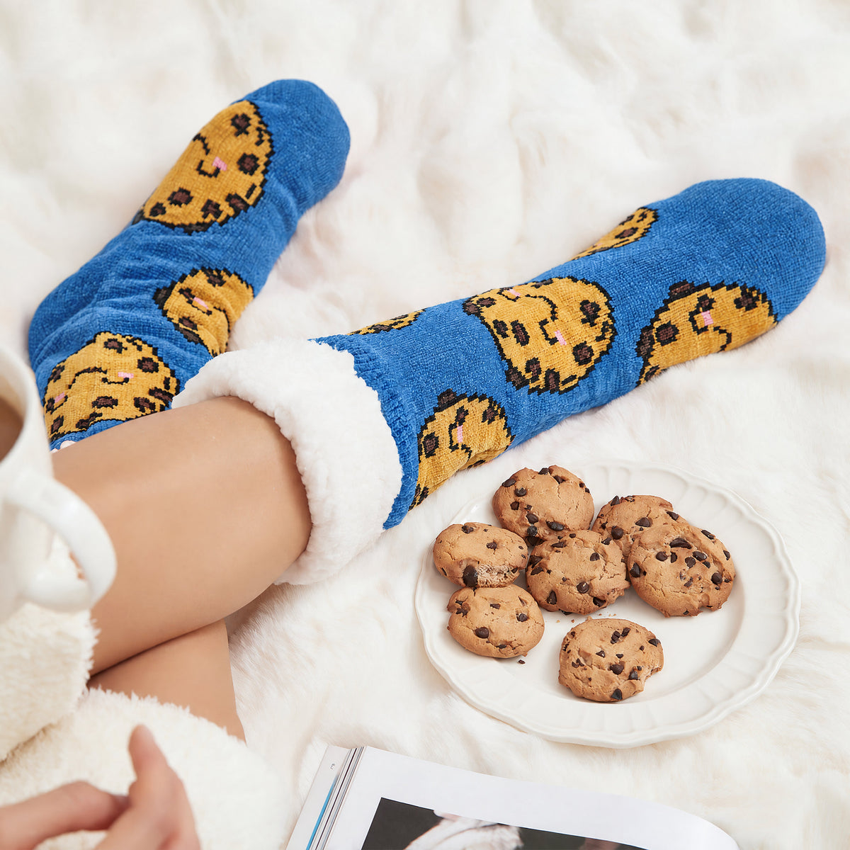 The Foozie™ Cookie slipper socks, with a plate of cookies