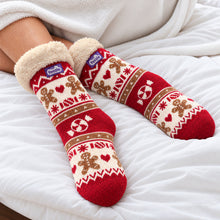 Load image into Gallery viewer, The Foozie™ Christmas Gingerbread slipper socks, on a cosy duvet
