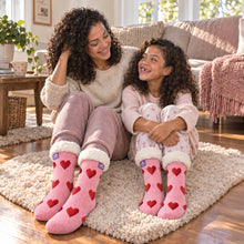 Load image into Gallery viewer, The Foozie™ Love Heart slipper socks, on a fluffy rug
