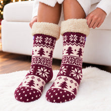 Load image into Gallery viewer, The Foozie™ Christmas Nordic slipper socks, standing on a rug
